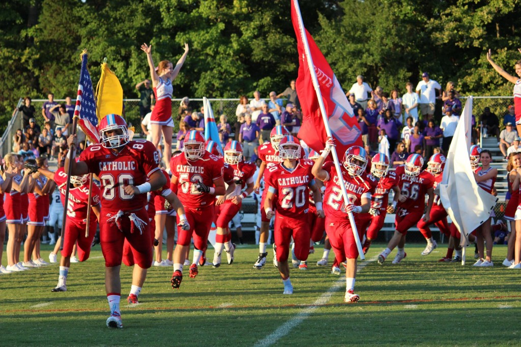 Football Team storming onto the field